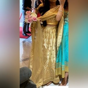 Indian outfit: It’s 3 pieces (top, skirt, and wrapping cloth) medium.